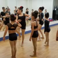 <p>Dancers warm up prior to a class in New York.</p>