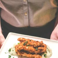 <p>Almond-crusted frog legs at Beacon Hotel Restaurant.</p>