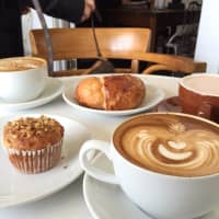 <p>A sampling of baked goodies and lattes at American Bulldog Coffee Roasters, which has locations in Chestnut Ridge and Ridgewood, N.J.</p>