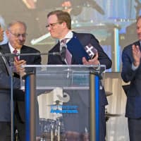 <p>Elliott Bundy on New Canaan, a managing director of XL Catlin, accepts a Red Apple Award on behalf of the global insurer during The Maritime Aquarium at Norwalk’s “Cirque de la Mer” gala on April 20.</p>