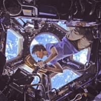 <p>European Space Agency astronaut Samantha Cristoforetti takes pictures of Earth from the cupola of the International Space Station in a scene from “A Beautiful Planet,” a new IMAX movie opening Friday at The Maritime Aquarium at Norwalk.</p>