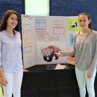 <p>Juliana Garces, Leigh Young-Lawler and Sam Jones display their project May 23 during the end-of- year celebration for the TeMPEST teen program at The Maritime Aquarium at Norwalk.</p>