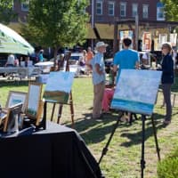<p>Art lovers roam around the 2015 Art in the Park in downtown Piermont.</p>
