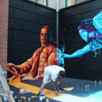 <p>Michael DeAngelo&#x27;s mural on Court Street depicting CT Transit bus driver Dave Higgins [left] and area surgery resident Michelle Salazar [right].</p>