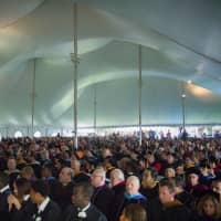<p>Attendees under the tent.</p>