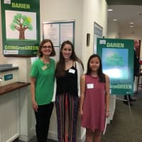 <p>DCC Executive Director Susan Cator with the winners of the poster contest, Darien High School students Cheyenne de la Rivera and Valerie Le.</p>