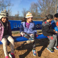 <p>Students at Coman Hill Elementary School in Armonk try out its &quot;Buddy Bench.&quot;</p>