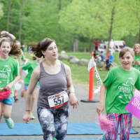<p>Christina Vita finishes a 5K race with Girls on the Run.</p>