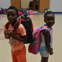 <p>Two Danbury children are happy recipients of United Way’s Back to School program.</p>