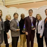 <p>Dion Drew, fourth from left, representing Greyston Bakery founder Bernie Glassman; Bill Bolling, former executive director of the Atlanta Community Food Bank, third from left; and Gavin Armstrong, founder of Lucky Iron Fish, show off the awards.</p>