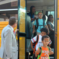 <p>Students arrive for the first day of school.</p>