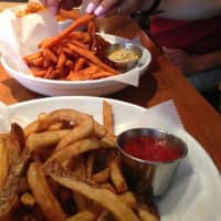 <p>Customers at The Barley House in Thornwood dig into a plate of sweet potato fries.</p>