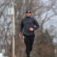 <p>Eric Gruettner, a cross-country and track teammate of John Barresi was the first male finisher in the 2014 race..</p>
