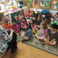 <p>Briarcliff Nursery School children donate proceeds from the school’s Village Day event to MaryAnn Power, Ossining Food Pantry volunteer.</p>