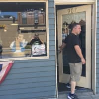 <p>Newly shorn, one of Mark Sinnis&#x27; last customers leaves the Beale Street Barber Shop in Peekskill Wednesday.</p>