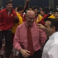 <p>Bergen Catholic wrestling coach Dave Bell and assistant Dominick Spataro celebrate after the Crusaders won their fifth straight Non-Public A title.</p>