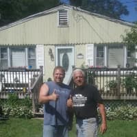 <p>Frank Bernat and Glenn Tennelli, senior site supervisor for Roof4Roof, stand in front of Bernat&#x27;s home.</p>