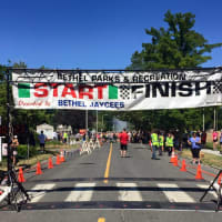 <p>With temps in the high 80s, the finish line must have looked good to runners participating in the John DeMille Firecracker Road Race in Bethel Monday.</p>