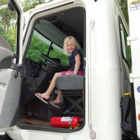 <p>A girl sits in the cab of a big rig during Kent Public Library&#x27;s &quot;Big Truck and Community Vehicle Day&quot; on June 4.</p>