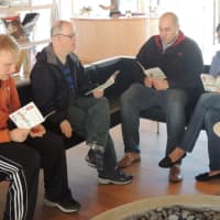 <p>Bjorn Swartings of New Canaan, Neil Reilly of Wilton, Paul Pramer of Darien and STAR staff member Annette Clark enjoy their book club in the library at Grace Farms&#x27; River Building.</p>