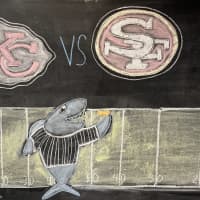 <p>A chalkboard drawing at&nbsp;SEA LIFE Aquarium New Jersey in East Rutherford showing the Super Bowl LVIII matchup.</p>
