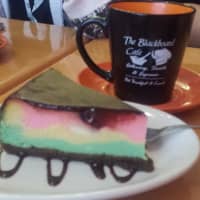 <p>The Blackboard Cafe in Wappingers Falls is known for its home-baked goodies, but none are as popular as its decadently rich rainbow cookie cheesecake.</p>