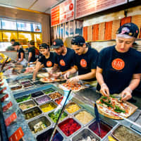 <p>Customers can experience an interactive open-kitchen format that allows guests to customize one of the menu’s signature pizzas or create their own.</p>
