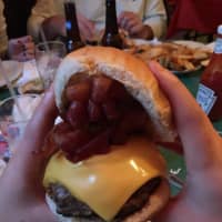 <p>Eating the bacon-cheese burger with a &quot;little&quot; extra b at The Blazer Pub in North Salem takes a two-handed approach.</p>