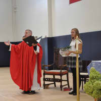 <p>Father Matt Janeczko celebrated a Mass of the Holy Spirit on Monday at School of the Holy Child, blessing a new field house during a ceremony in The Kelly Gymnasium. Assisting him during the ceremony was Holy Child sophomore Annabelle Schultze.</p>