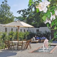 <p>Michael Bruno and friends relax in the courtyard at Blue Barn in Sloatsburg.</p>