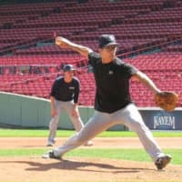 <p>Former Columbia University pitcher and current baseball writer Bob Klapisch takes the mound at Fenway Park.</p>