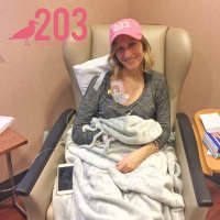 <p>Stamford resident Bonnie Wilson, 25, wears a pink 203 hat on her first day of chemotherapy at Stamford Hospital this week. The hats are being sold by The Two Oh Three online company to raise money for her treatment.</p>