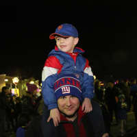 <p>This lucky boy got a boost from his dad to see the festivities better.</p>