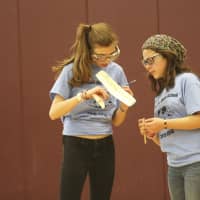 <p>Westlake&#x27;s Brianna Calamis and Taylor Chiera built a balsa wood plane powered by elastic bands. The competition was to have their plane fly in the air the longest.</p>