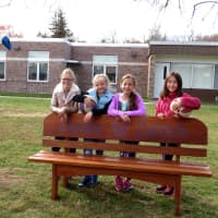 <p>Meadow Pond Elementary School fourth-grade students, from left, Julia Johnston, Brooke Habinowski, Talia Blechman and Kristina Fonseca connect at the school’s new Buddy Bench</p>