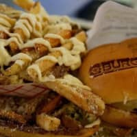 <p>BurgerFi in Poughkeepsie is so proud of its all-natural foods and grass-fed beef that it literally brands its burger buns with its name.</p>