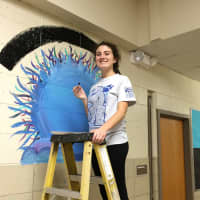 <p>Westlake High School sophomore Caitlyn Lyons&#x27; &quot;warm fuzzy&#x27; mural in the Columbus lobby reminds students that &quot;kindness is contagious.&quot;</p>