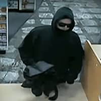 <p>The alleged robbery suspect is shown captured on surveillance camera inside the store, according to police.</p>