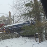 <p>A heavy duty wrecker pulls out the crashed CTTransit bus in Greenwich.</p>