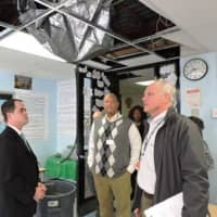 <p>State Sen. David Carlucci tours Ramapo High School with school officials recently to look over the leaky roof. The lawmaker said that $1 million has been found to make repairs there.</p>