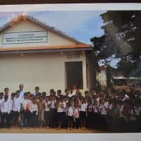 <p>Students stand outside the Zahn School in Cambodia.</p>