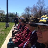 <p>Local veterans watch as members of the Harrison High School Marching Band perform at a  ceremony in their honor.</p>