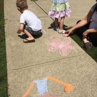 <p>Kids brighten up the sidewalks of East Rutherford Memorial Library.</p>