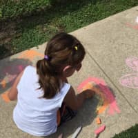 <p>Kids brighten up the sidewalks of East Rutherford Memorial Library.</p>