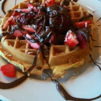 <p>Waffles drizzled with Nutella, a hazelnut-cocoa spread, and topped with strawberries, at Chip&#x27;s Family Restaurant in Fairfield,</p>