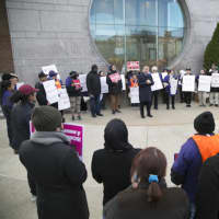 <p>Supporters rally in a circle around State Sen. Carlo Leone (D-Stamford) as he speaks at a rally for immigrant rights outside the courthouse in Stamford.</p>