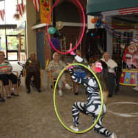 <p>Circus acts included a professional stilt walker and hula hoop performer.</p>