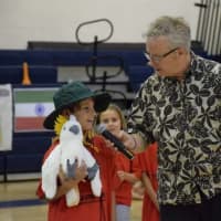 <p>Circus Minimus ringmaster Kevin O’Keefe talks with a student from Bronxville Elementary School during the school&#x27;s 17th Annual &quot;Circus Around the World&quot; event.</p>