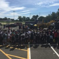 <p>Clarkstown North High School students watch a demonstration of a driving while texting accident put on by the Clarkstown Police Department.</p>