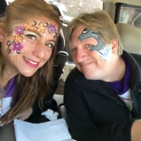 <p>Professional face painter Claudia Nieswand of Pompton Lakes is pictured with her husband Steve.</p>